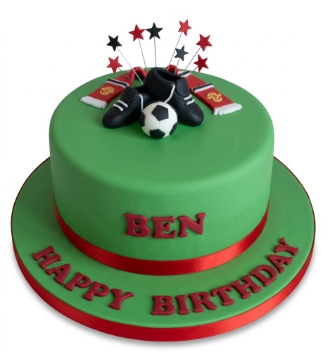 Green football themed birthday cake with Manchester United scarves, boots, ball, and star toppers.