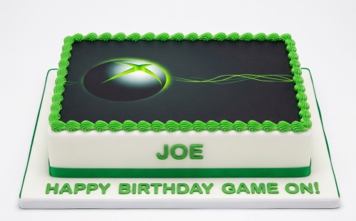 Rectangular Xbox themed birthday cake with green piped icing and a personalised message.