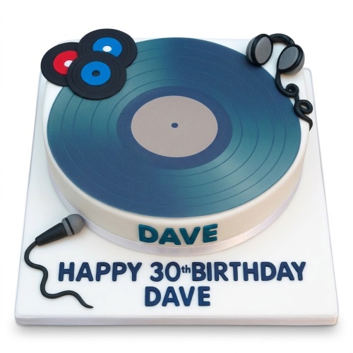 Round white birthday cake with a blue vinyl record, headphones, microphone, and custom message.