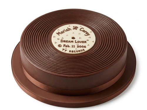 Round chocolate-coloured cake shaped like a vinyl record with a customisable white label and brown ribbon.