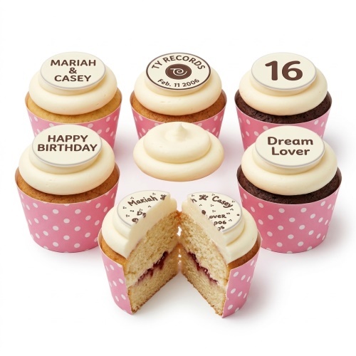 Vanilla and chocolate cupcakes with white frosting and customisable edible disc toppers, in pink polka dot wrappers.