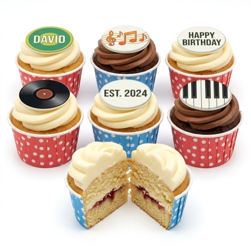 Assortment of music-themed birthday cupcakes with musical notes, piano keys, vinyl record, and custom message toppers.