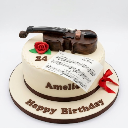 Two-tier cream fondant cake with an edible brown violin, sheet music, red rose, and red ribbon.