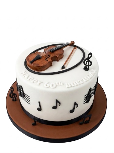 White round birthday cake with a brown 3D violin and bow on top, surrounded by black musical notes.