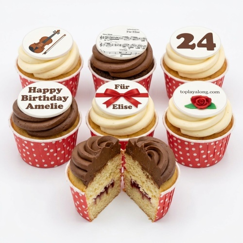 Birthday cupcakes with violin, sheet music, red bow, rose, and custom age toppers.