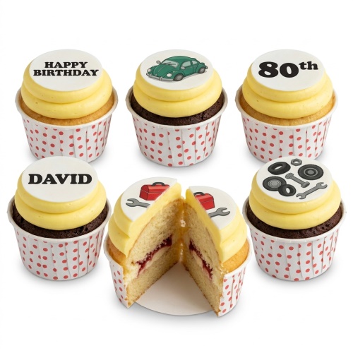 Cupcakes with yellow frosting and edible toppers featuring a green classic car, a red toolbox with a wrench, and car parts.