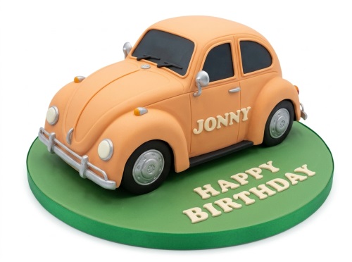 3D orange Volkswagen Beetle car cake on a green board with 'Happy Birthday' text.
