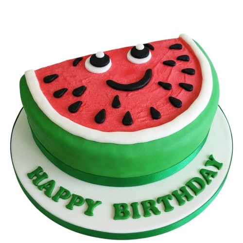 Watermelon slice shaped birthday cake with a smiling face and 'Happy Birthday' message on the board.