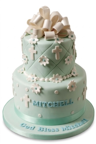 Two-tier mint green christening cake with white crosses, flowers, and a large bow, with space for a custom name.