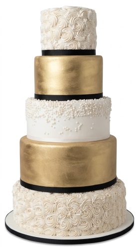 Five-tier luxury birthday cake with gold, white rosettes, and pearl decorations, accented with black ribbons.