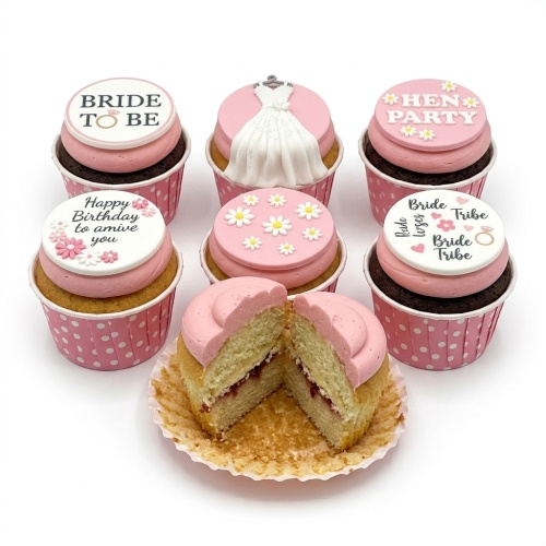 Pink cupcakes with bridal shower, hen party, and birthday themed fondant toppers.