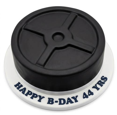 Round black cake designed as a gym weight plate with a white base and custom message.