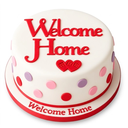 White Welcome Home cake with red lettering, heart houses, and colourful polka dots.