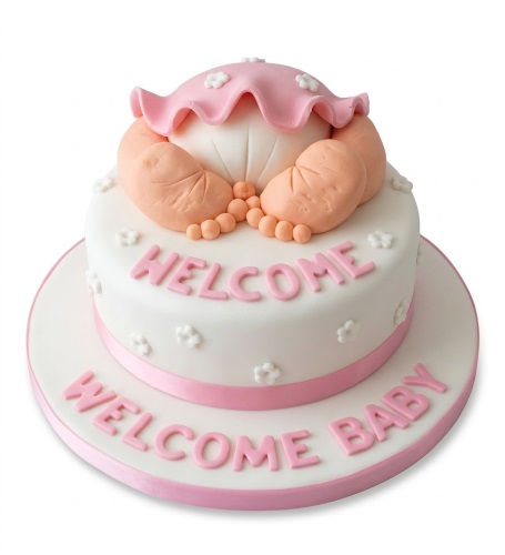 Two-tier white and pink baby shower cake with 3D baby's bottom and feet, decorated with small white flowers and 'Welcome Baby' message.