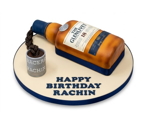 3D Glenlivet whisky bottle birthday cake with chocolate spill and personalised message.
