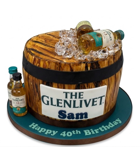 Round whisky barrel themed birthday cake with miniature bottles and ice, personalised.
