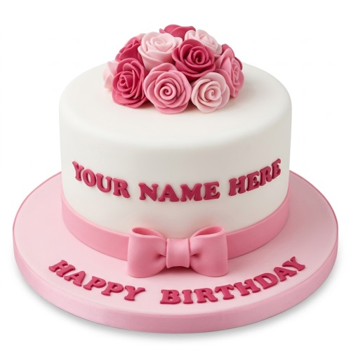 White round birthday cake with pink sugar roses, ribbon, bow, and custom message.