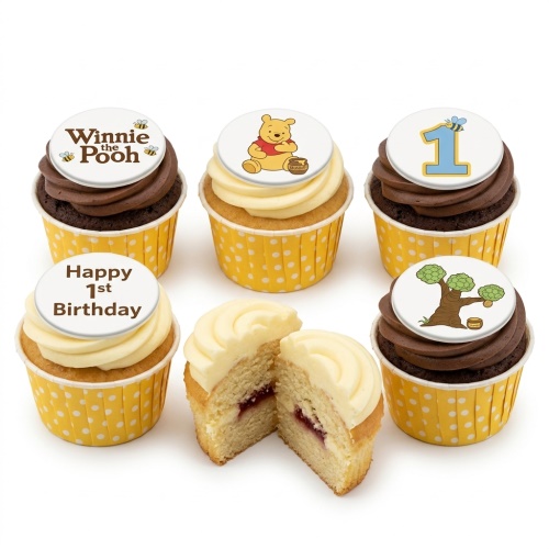 Winnie The Pooh 1st Birthday cupcakes with Pooh, bees, number 1, and a tree topper