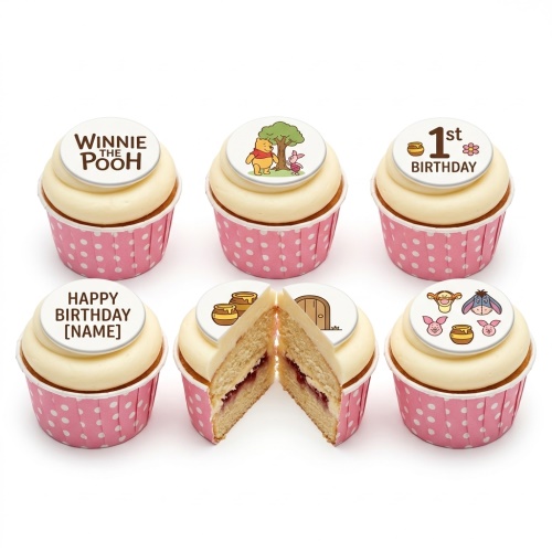 Six Winnie the Pooh themed cupcakes with white frosting, pink polka dot cases, and edible character toppers.