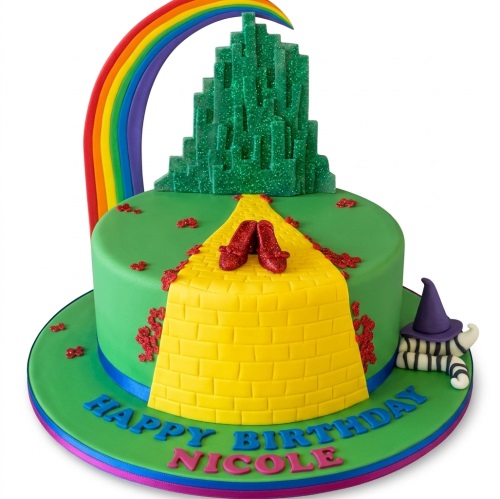 Wizard of Oz themed birthday cake with Emerald City, Yellow Brick Road, ruby slippers, and rainbow.