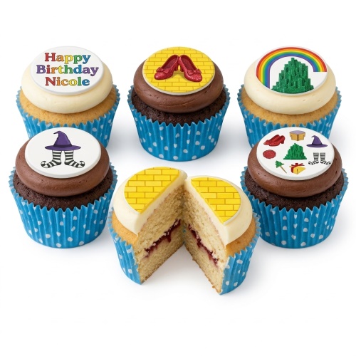 Wizard of Oz themed cupcakes with ruby slippers, Emerald City, witch's legs, and yellow brick road toppers.