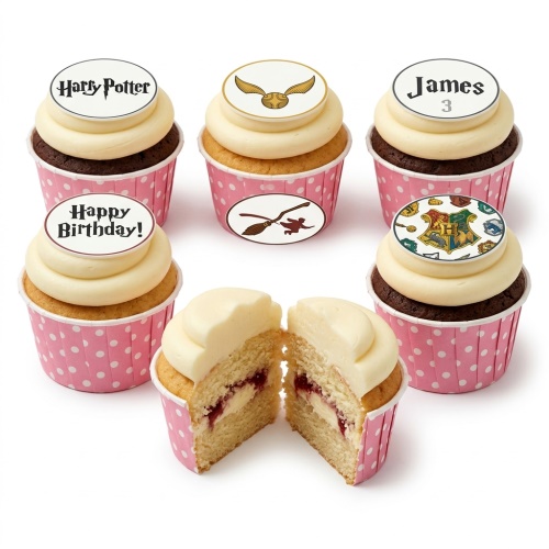 Harry Potter themed cupcakes with Golden Snitch, Hogwarts crest, and broomstick toppers for a birthday.