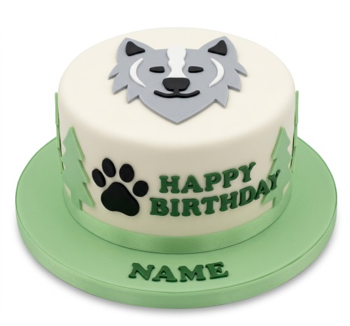Round white birthday cake with a grey wolf head, green trees, and a black paw print, with 'Happy Birthday' and a custom name.