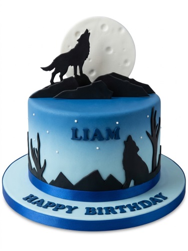 Round blue ombre wolf theme birthday cake with howling wolf silhouette and moon.