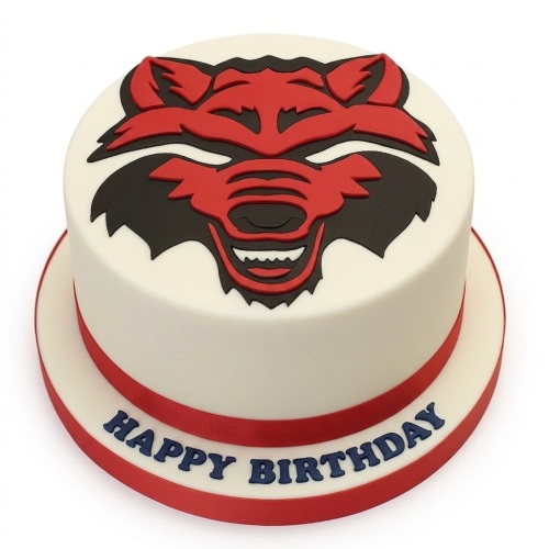 Round white birthday cake with a red and black wolf head design and red ribbon.