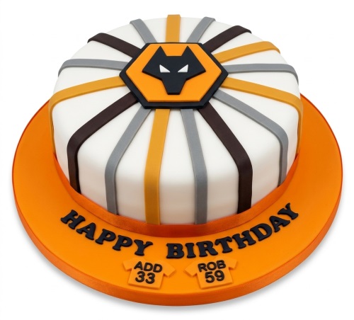Round white fondant cake with orange, black, grey, and brown stripes, featuring a Wolverhampton Wanderers football club logo and 'Happy Birthday' message.