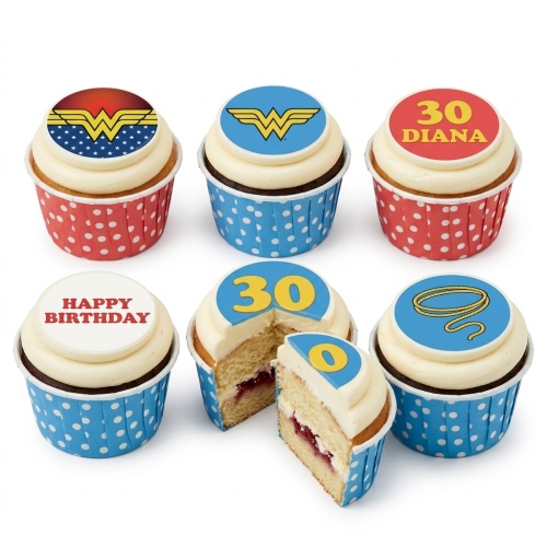 Wonder Woman themed cupcakes with superhero logos and lasso, featuring custom age and message toppers in red and blue cases.