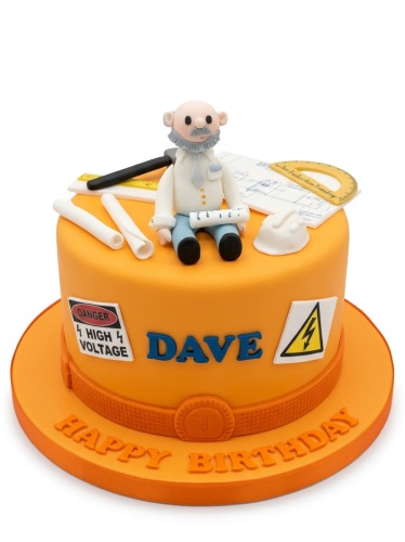 Orange single-tier birthday cake with a fondant engineer figure, blueprints, hard hat, and "Danger High Voltage" sign.
