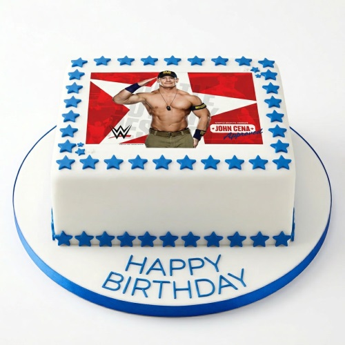 Square white fondant cake with an edible image of John Cena, bordered by blue stars, with a blue ribbon and 'Happy Birthday' message on the board.