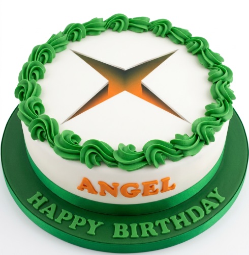 Round white birthday cake with green Xbox logo, green swirled icing, and personalised name.