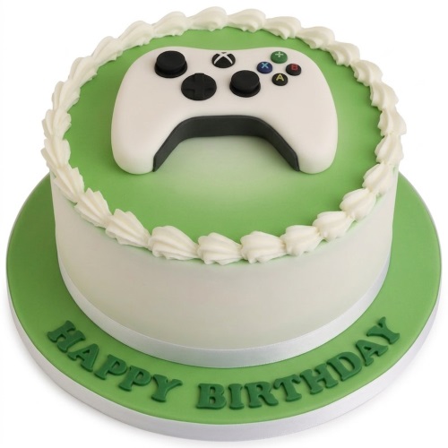 Round white and green birthday cake with a 3D fondant Xbox controller on top.