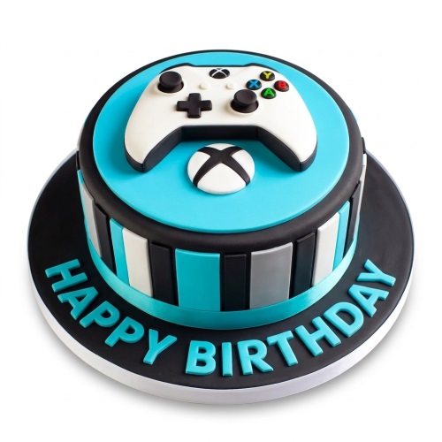 Round single-tier Xbox themed birthday cake with a white controller, turquoise, black, white, and grey stripes, and 'Happy Birthday' message.