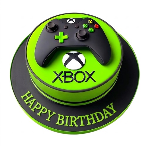Round green and black Xbox themed birthday cake with a 3D Xbox controller on top and 'Happy Birthday' message.