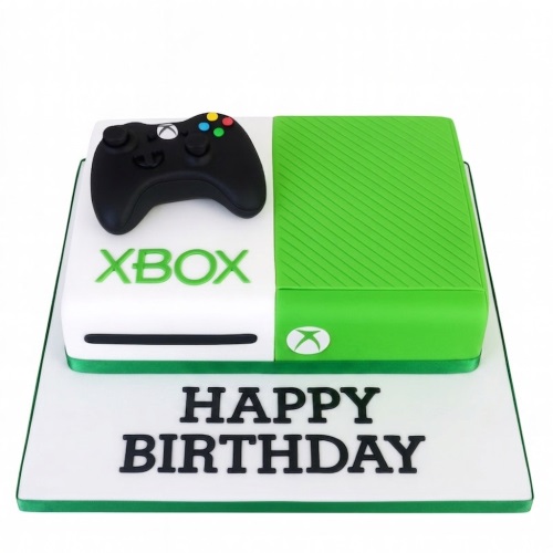 Xbox console and controller themed birthday cake with 'Happy Birthday' message on the board.