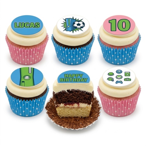 Six cupcakes with white frosting, blue and pink wrappers, topped with gaming console, football, controller icons, 'LUCAS', '10', and 'HAPPY BIRTHDAY' toppers.