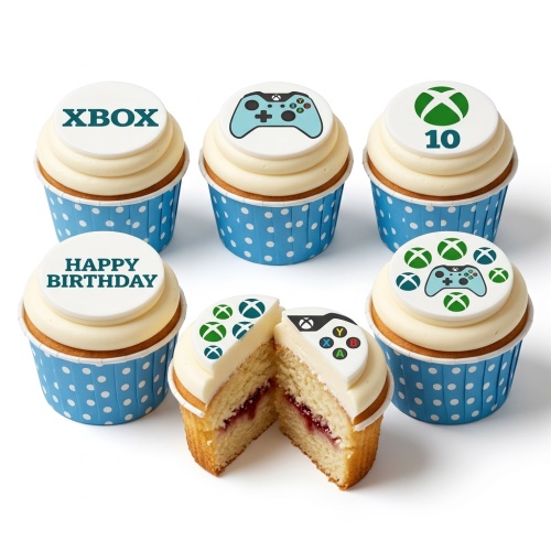 Six Xbox themed cupcakes with white frosting, blue polka dot cases, and edible toppers featuring Xbox logos and controllers.