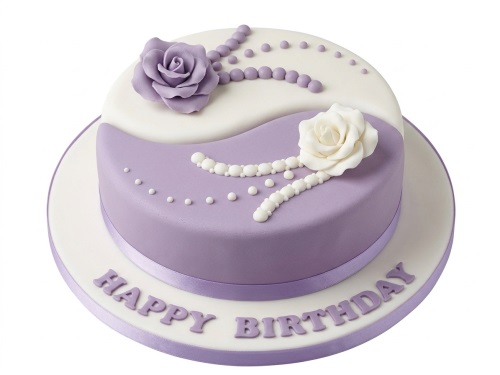 Round lavender and white birthday cake with sugar roses and pearl decorations, with 'Happy Birthday' message.
