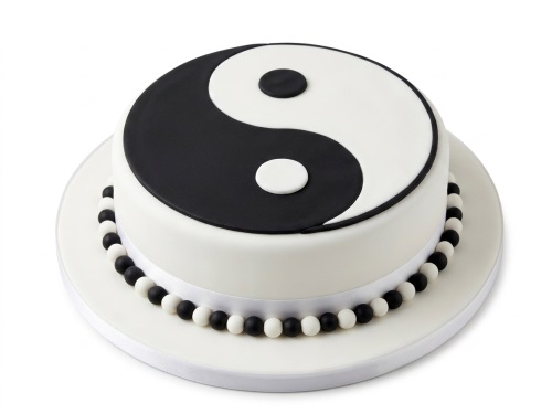 Round black and white Yin and Yang symbol cake with edible pearl border.