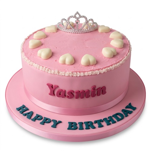 Pink round birthday cake with a silver tiara, white hearts, and personalised message.