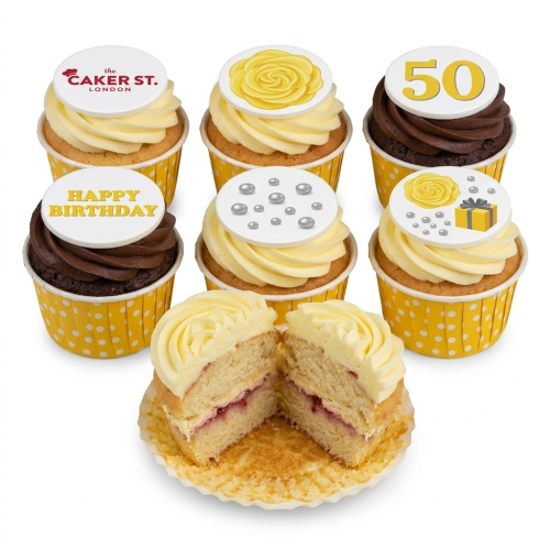 A selection of yellow and chocolate cupcakes with yellow rose, silver sprinkles, 'Happy Birthday' and '50' toppers.