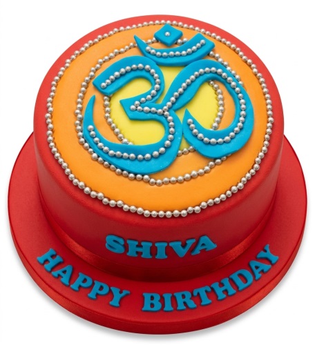 Round red, orange, and yellow Om symbol cake with silver beads and custom message.