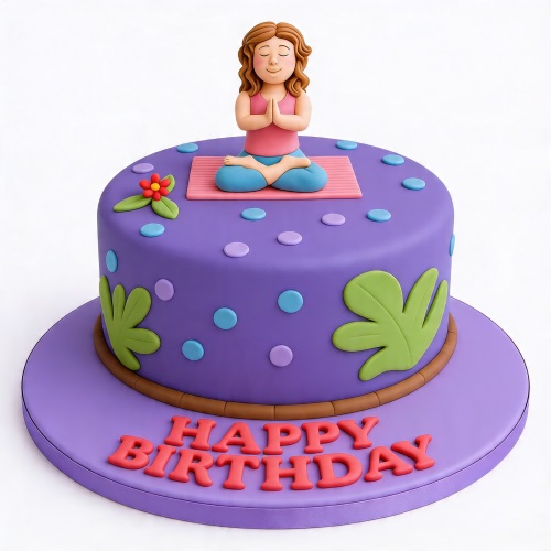 Round purple birthday cake with a fondant yoga figure on top, green leaves, and 'Happy Birthday' message.