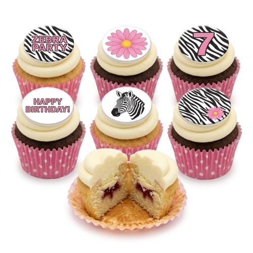 Zebra print birthday cupcakes with pink flowers and custom age topper.