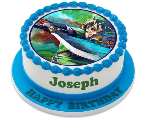 Round white and blue gaming birthday cake with an edible image of an action hero and a personalised message.