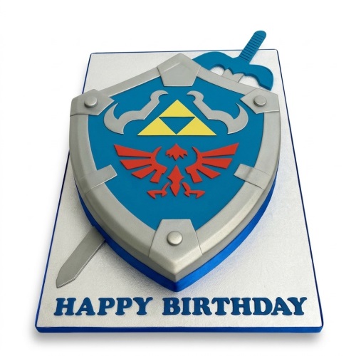 Legend of Zelda Hylian Shield birthday cake with sword and 'Happy Birthday' message.