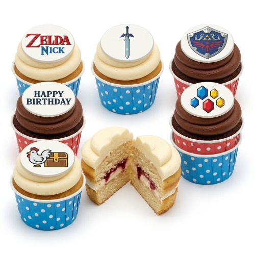 Vanilla and chocolate cupcakes with Zelda-themed edible toppers and 'Happy Birthday' message.